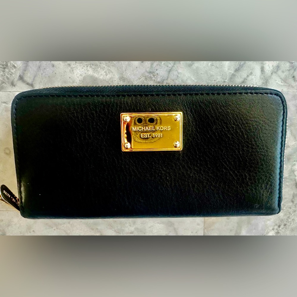 Michael Kors black leather zip around wallet.